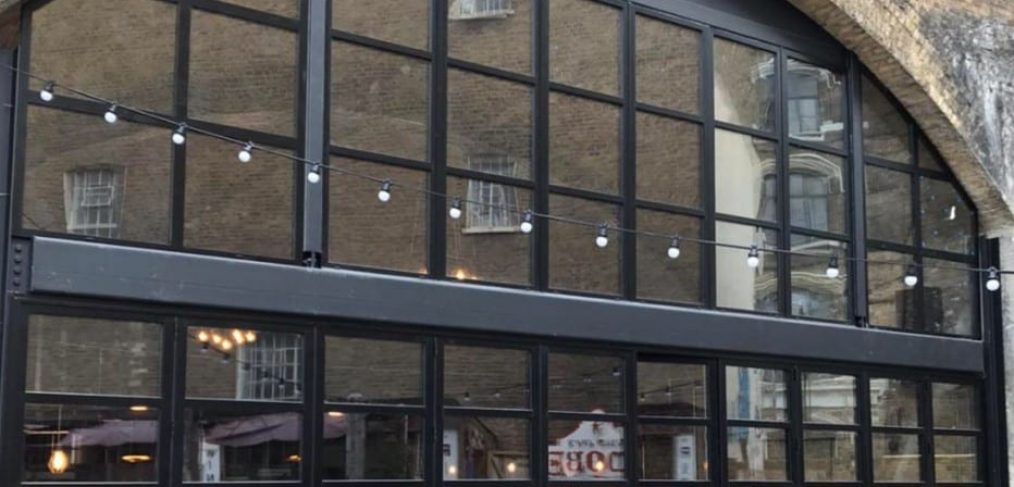 Aluminium bifold doors and windows in a custom frame fitted at a restaurant in London