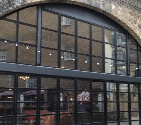 Aluminium bifold doors and windows in a custom frame fitted at a restaurant in London